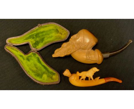 A meerschaum pipe, the bowl as a bearded man;  another Dog Walking, cased (2) 