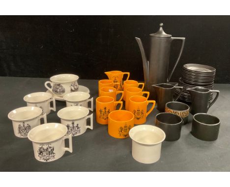 A Portmeirion "The British Herald" pattern coffee set in orange and black, comprising six coffee cans, saucers and side plate