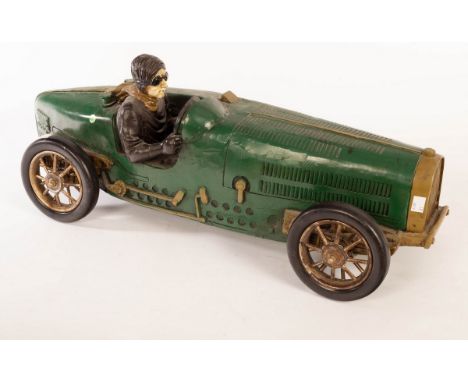 A fibreglass model of a 1930s Bugatti racing car and driver, painted green, 72cm wide  CONDITION REPORT: Condition informatio