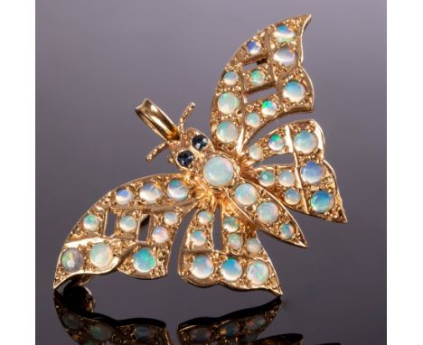 A 9ct gold butterfly pendant/brooch with sapphire eyes and opal set wings, 4cm wide approximately 5.1g CONDITION REPORT: Over