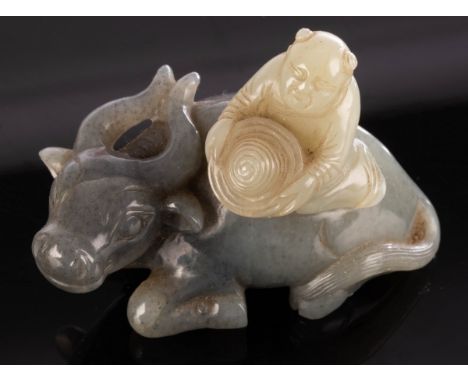 A Chinese grey jade, carved as a boy on the back of a buffalo, 7cm long CONDITION REPORT: Condition information is not usuall