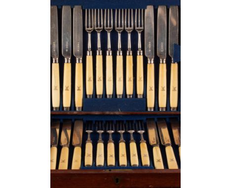 A Victorian silver fish set with ivory handles, Edward Gilbert, London 1884, comprising twelve three-pronged forks, 18cm and 