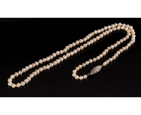 A single row pearl necklace, the graduated row of pearls to an oval diamond set clasp, 44cm long CONDITION REPORT: Condition 