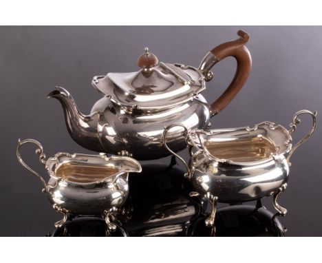 A Regency style three-piece silver tea service, Adie Bros., Birmingham 1925, approximately 910g CONDITION REPORT: Dent to sid