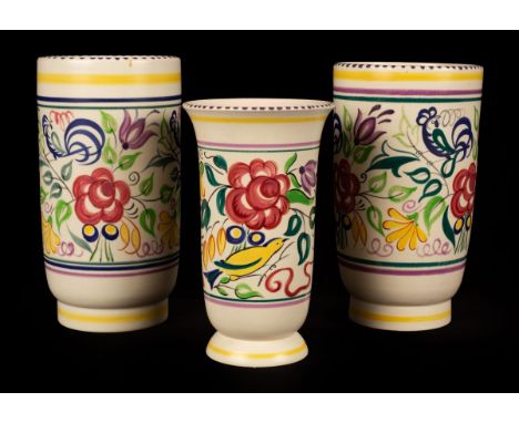 Poole Pottery, a near pair of floral vases, 25cm high and another floral vase, 21cm high/see illustration CONDITION REPORT: C