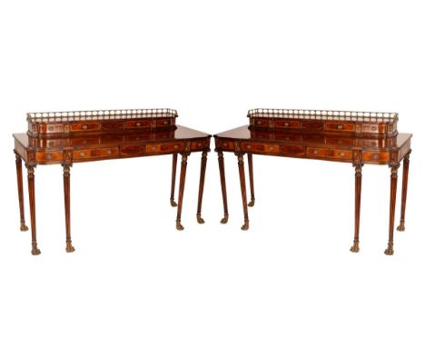 A pair of Georgian style console tables by Jonathan Charles, in flame mahogany, each with brass gallery, arrangement of drawe