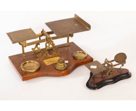 A set of late 19th Century parcel scales on an oak base and a small set of postal sales CONDITION REPORT: Condition informati