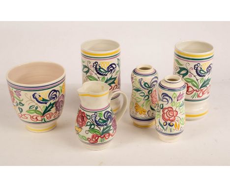 Poole Pottery, a pair of floral cylindrical vases, 24cm high, a pair of floral peanut-shape vases, 20cm tall, a floral plante