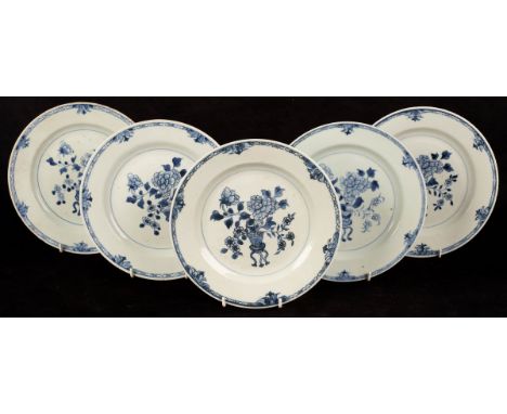 Five Chinese blue and white porcelain plates, 19th Century, decorated a peony in a planter to the centre and flower patterns 