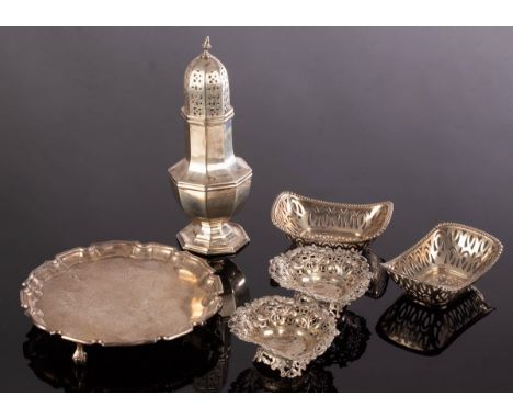 A silver octagonal sugar caster, R S, Sheffield 1933, four pierced sweetmeat dishes and a salver, approximately 455g CONDITIO