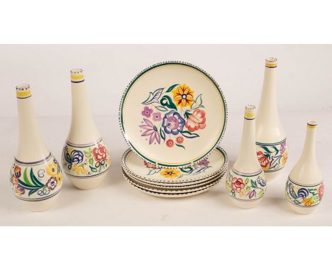Poole Pottery, six floral dinner plates, 23cm diameter, three floral bottle vases, 26cm high and two smaller CONDITION REPORT