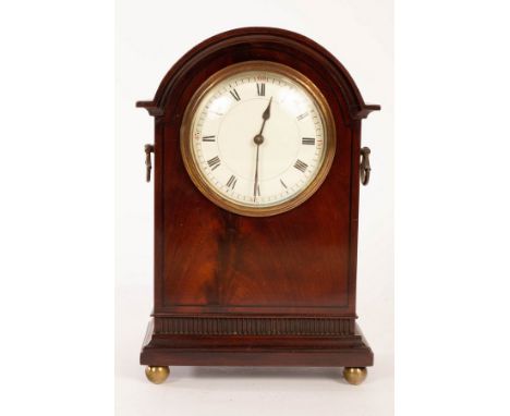 An Edwardian mahogany arch-top mantel clock on four ball feet, 25cm high CONDITION REPORT: Condition information is not usual