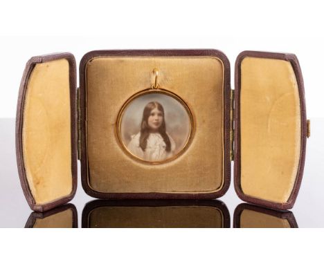 A circular photographic portrait in a 9ct gold frame, the reverse monogrammed CONDITION REPORT: Condition information is not 