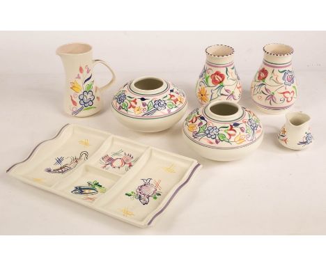 Poole Pottery, a four-section hors d'oeuvres dish, 34cm wide, a pair of floral baluster vases, 15cm high, a pair of squat flo