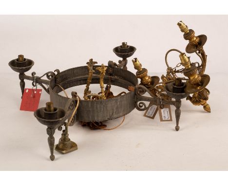 A wrought iron four-light electrolier with scroll supports to the arms, 58.5cm wide and a gilt metal three-light electrolier 