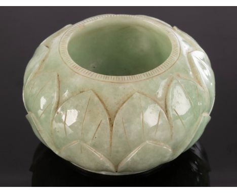 A Chinese celadon jade water vessel, 20th Century, carved lotus flowers around the body, 7cm wide CONDITION REPORT: Condition