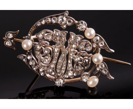 A diamond and pearl brooch of openwork form, with central initial 'M' to a scrolling surround of diamonds and pearls, 4.5cm w