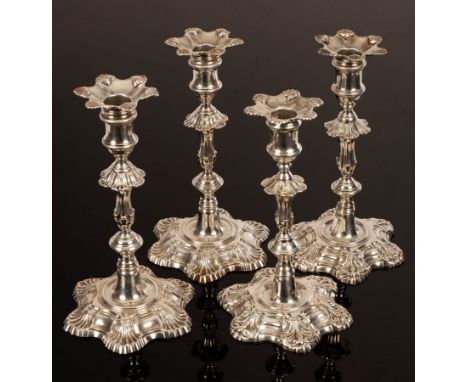 A pair of George II cast silver candlesticks, John Quantock, London 1756, of knopped form with shell motifs to the spreading 