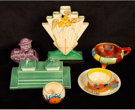 A Poole Pottery apple green inkstand, a Bruce Bairnsfather WWI Tommy money box, a Clarice Cliffe Crown tea bowl, saucer and v