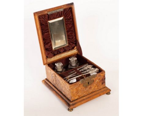 A late 19th Century continental pressed leather workbox, the cover and sides with hunting scenes, the interior part fitted, 1