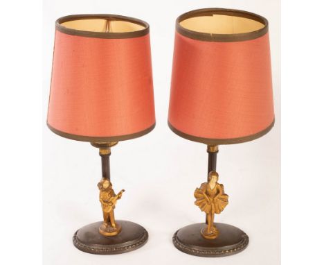 A pair of oxidized candlestick table lights, each with a gilt figure at the base, with ivorine heads, 27cm high  CONDITION RE
