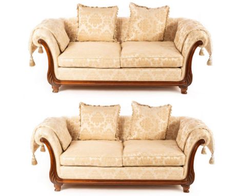 A pair of Victoria furniture two-seat sofas with carved scroll ends on turned feet, 224cm wide/Provenance: Purchased from Har