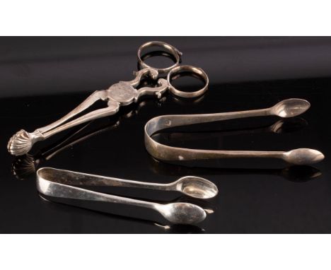 A pair of Georgian silver sugar nips, James Graham, London circa 1770, initialled and crested and two pairs of sugar tongs, a