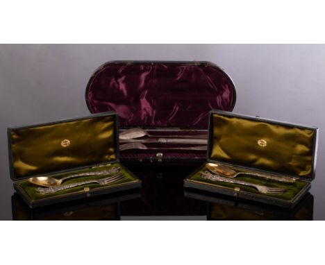 A cased silver set of knife, spoon and fork, the spoon and fork London 1894, the knife later and two cased sets of commemorat