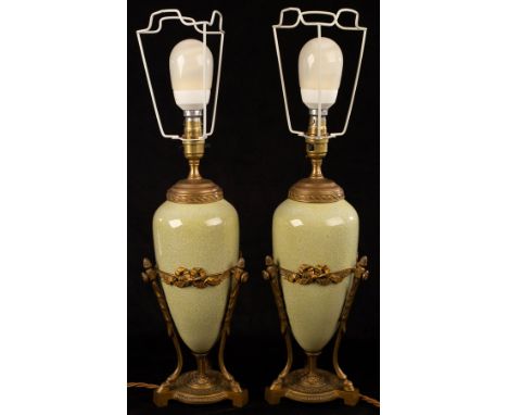 A pair of French table lamps of speckled green ceramic ovoid form on gilt metal tripod supports with hoof feet CONDITION REPO