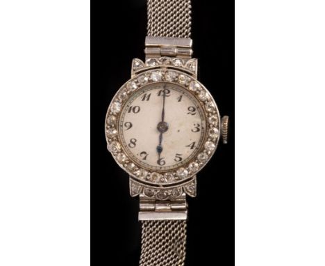 A lady's diamond set cocktail watch, the circular dial with Arabic numerals and a diamond bezel, the case labelled G & S Co. 