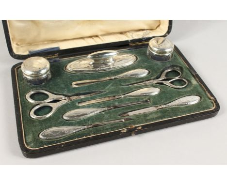 A MAPPIN &amp; WEBB CASED SILVER MANICURE SET. Chester 1912.