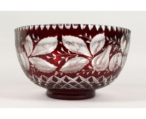 A LARGE BOHEMIAN RUBY TINTED CIRCULAR BOWL, engraved with pineapples and other fruit. 9.5ins diameter.