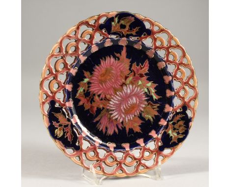 A GOOD ZSOLNAY PIERCED PLATE. Printed mark.  8ins diameter.