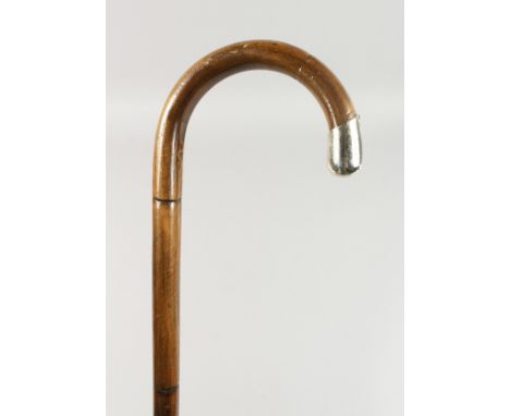 A VICTORIAN SILVER TIPPED WALKING STICK. 3ft long.