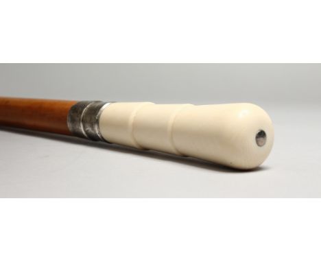 A VICTORIAN TURNED IVORY HANDLED WALKING STICK with engraved silver band. Birmingham 1897.  2ft 10ins long.