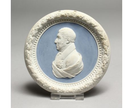 A SEVRES BLUE AND WHITE CIRCULAR PORTRAIT PLAQUE. 4.25ins diameter.
