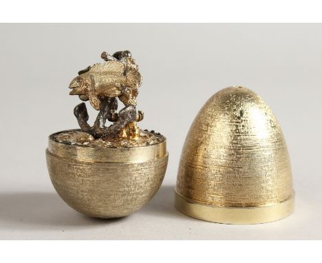 A STUART DEVLIN SILVER GILT EGG opening to reveal fishes London 1958, No. 183, in original box.