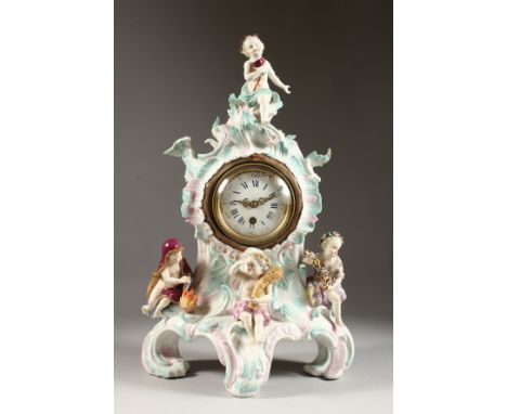 A GOOD DRESDEN PORCELAIN MANTLE CLOCK, with four putti depicting the seasons, the drum movement with white dial and blue &amp