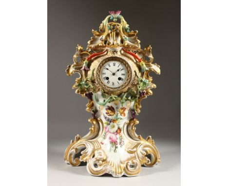 A GOOD 19TH CENTURY FRENCH PORCELAIN MANTLE CLOCK, Possibly JACOB PETIT, the case with gilt scrolls and painted with flowers,