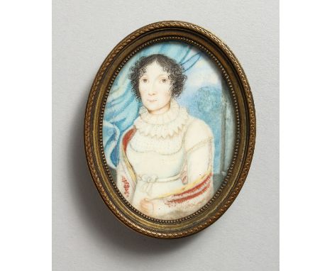 A SMALL 19TH CENTURY OVAL PORTRAIT MINIATURE, three-quarter length of a lady wearing a white dress, in a gilt metal frame. 3i