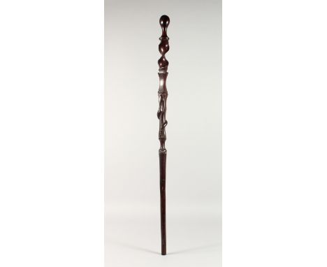 A NATIVE CARVED SNAKE WALKING STICK. 3ft 1ins long.