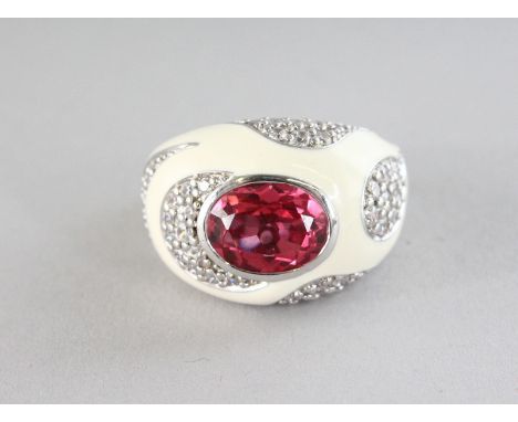 A SILVER WHITE ENAMEL DESIGNER RING.