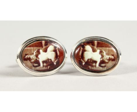 A PAIR OF SILVER AND ENAMEL EROTIC CUFFLINKS.