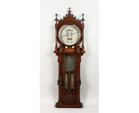 AN UNUSUAL 19TH CENTURY OAK CASED ROYAL POLYTECHNIC BAROMETER by JOSEPH DAVIS &amp; CO., FITZROY WORKS, LONDON, of GOTHIC DES