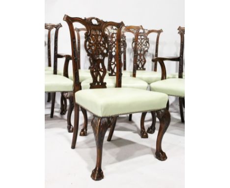 A GOOD SET OF SIX SINGLE AND TWO CARVING CHIPPENDALE STYLE MAHOGANY DINING CHAIRS, with pierced splats, padded seats, on cabr