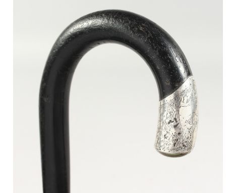 A WALKING STICK with silver tip. 3ft long.