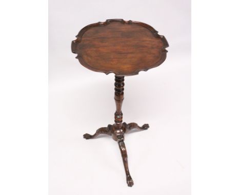 A GEORGIAN MAHOGANY TALL TRIPOD TABLE, with piecrust top, turned column and curving legs with claw feet. 2ft 8ins high.