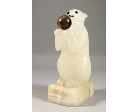 A CARVED ALABASTER POLAR BEAR LAMP. 9.5ins high.