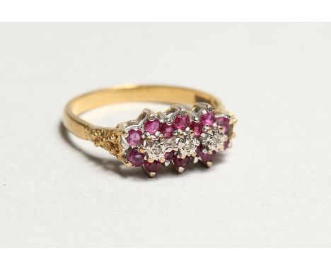 AN 18CT GOLD, DIAMOND AND RUBY RING.