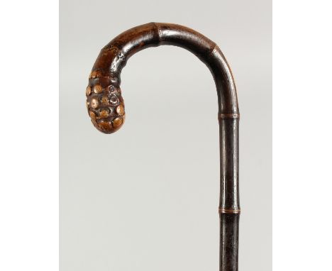 A VICTORIAN BAMBOO WALKING STICK. 2ft 10ins long.